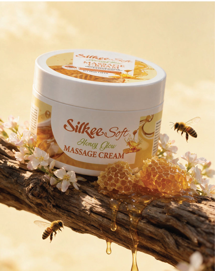 Silkee Soft Honey Glow Massage Cream jar on honeycomb with dripping honey